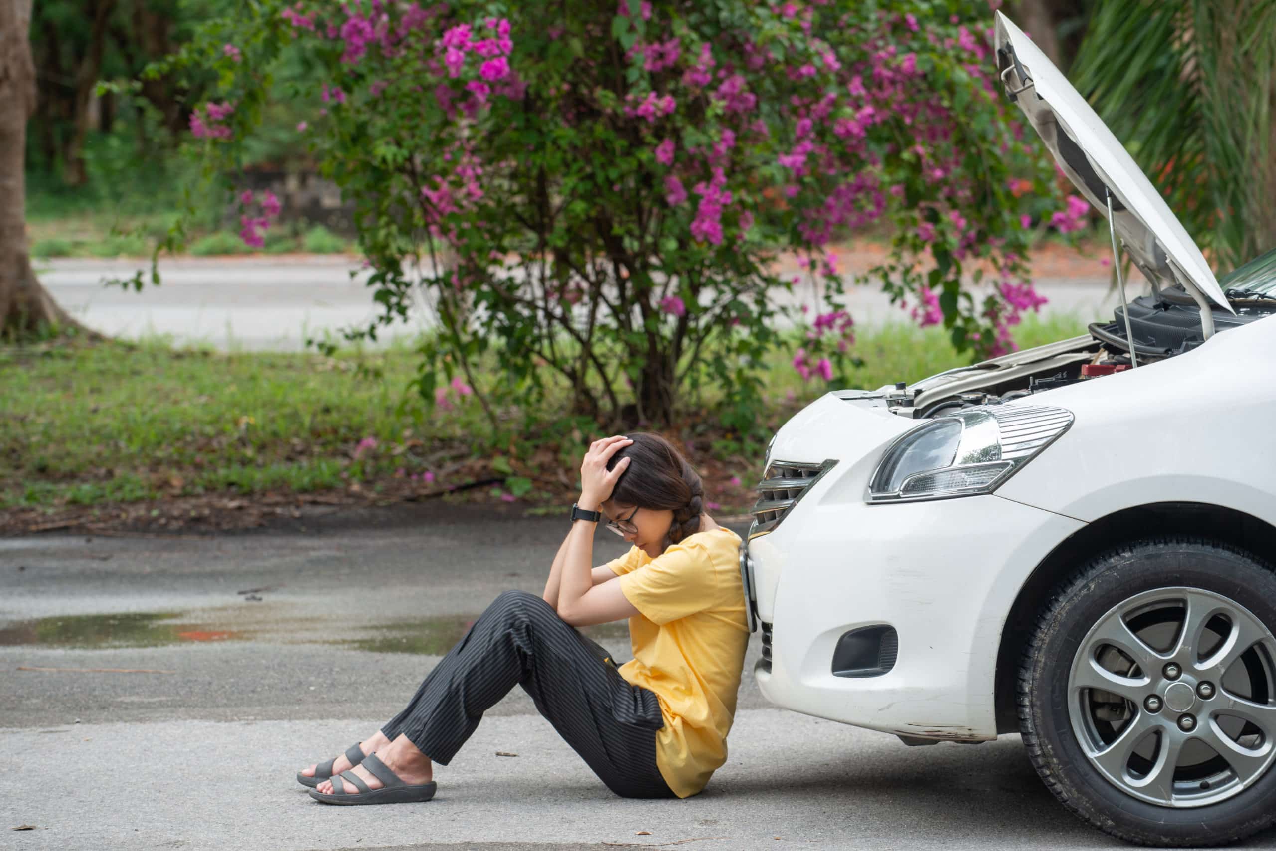 woman stressed with broken down car