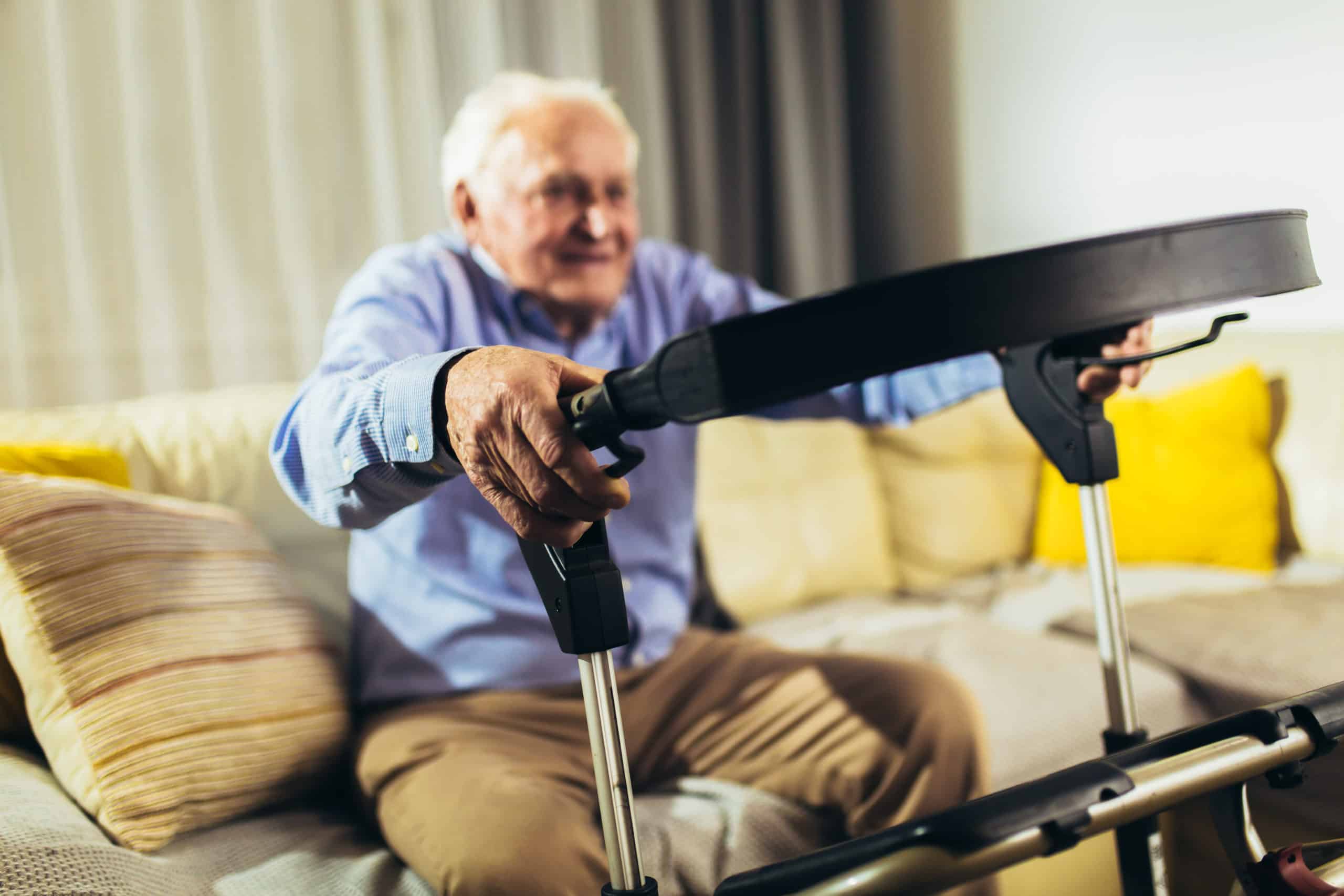 elderly man using walker